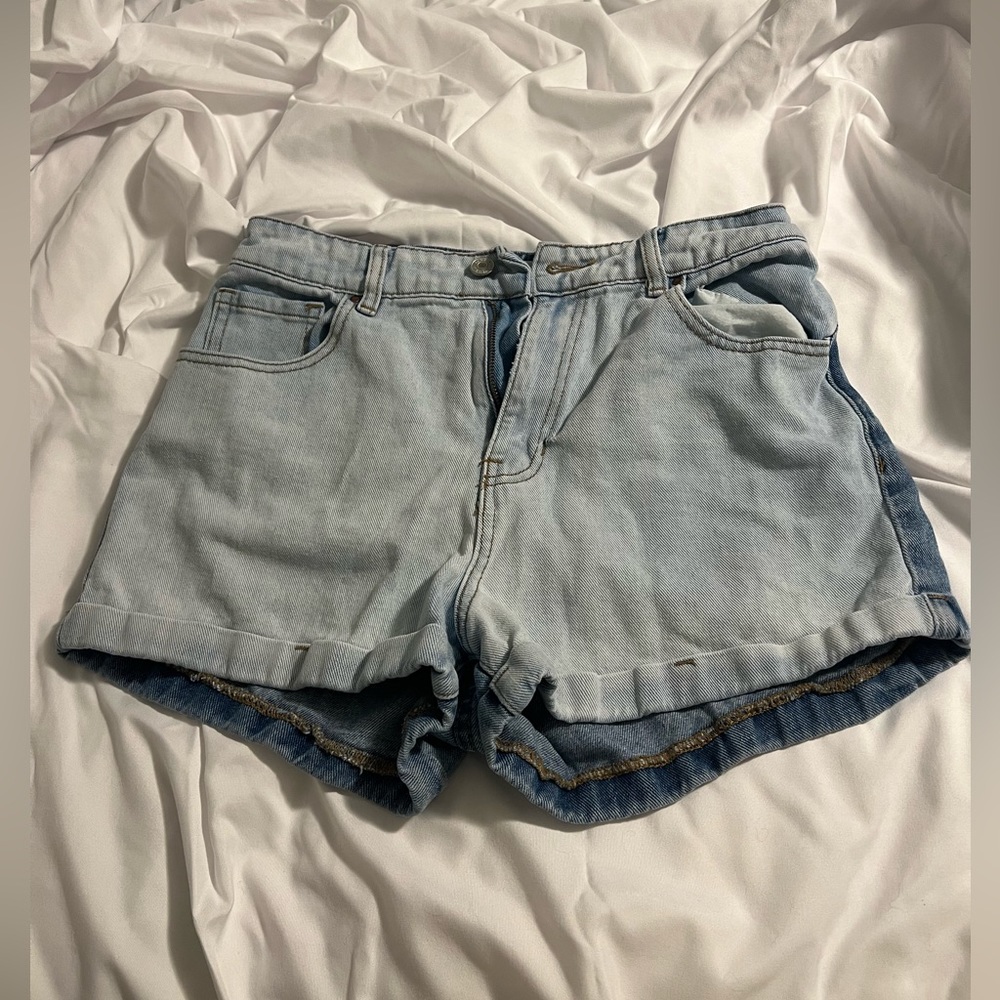 Pair of shorts half and half light wash and medium wash